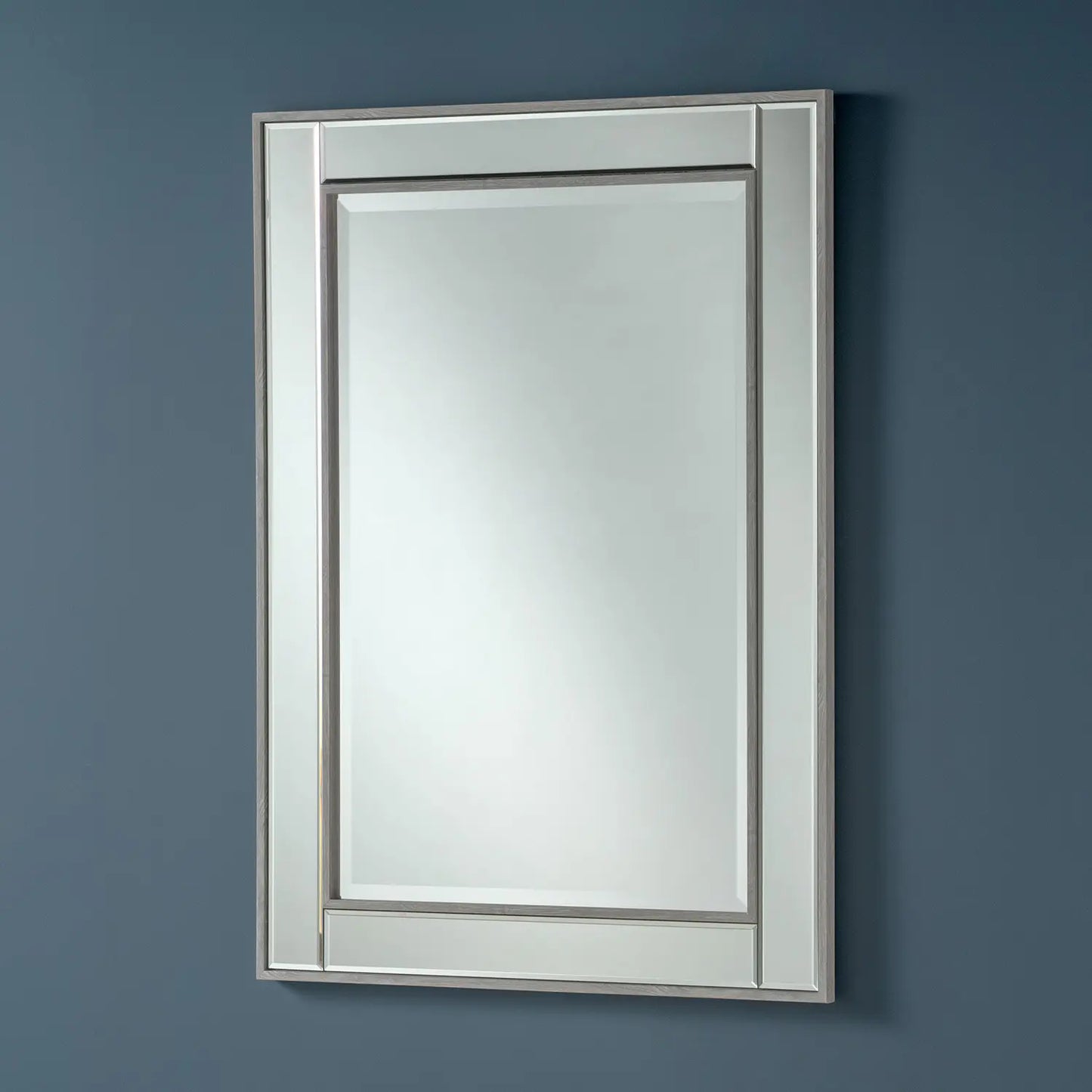 Large rectangular wall mirror with a rustic grey frame and beveled edges.