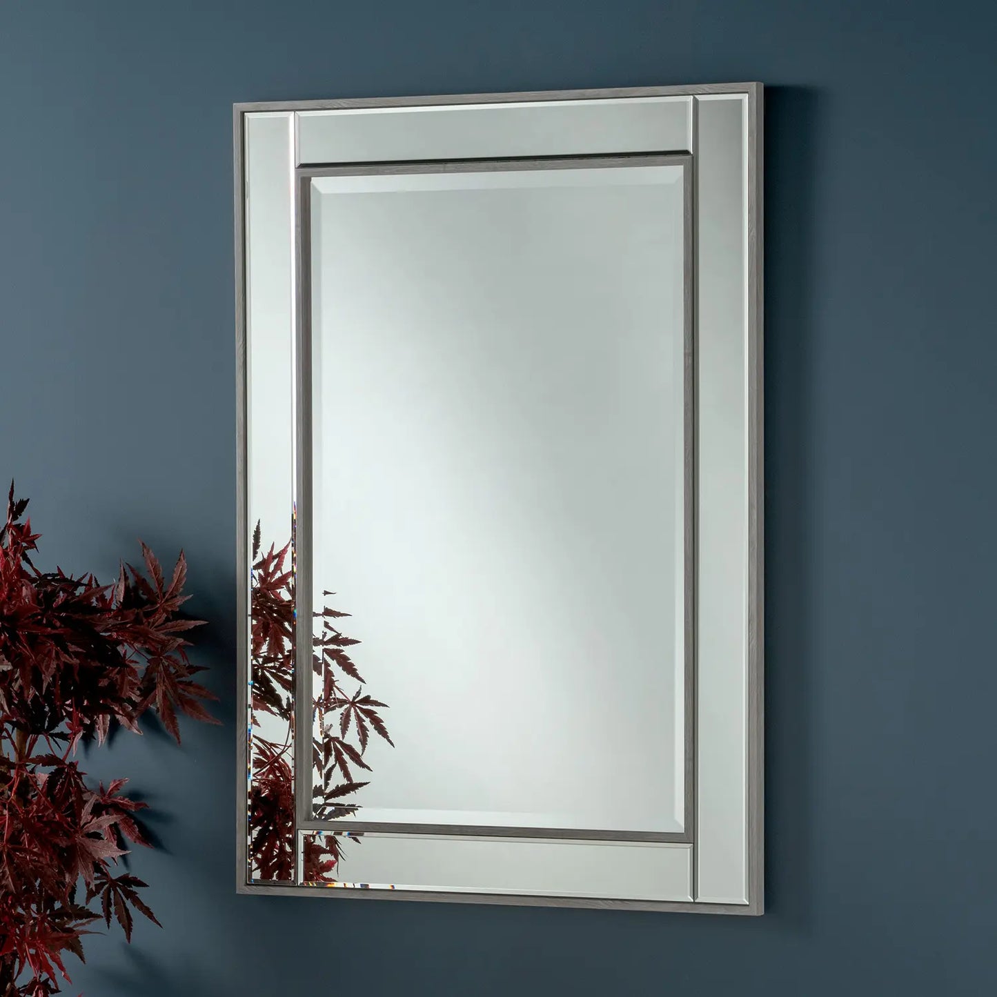 Medium rectangular wall mirror with a rustic grey frame and beveled edges.