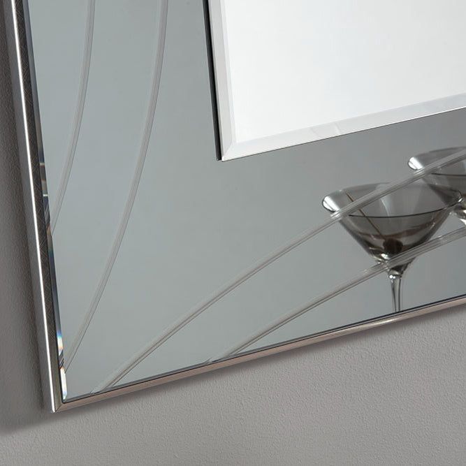 Large decorative beveled mirror with a silver frame and etched design.