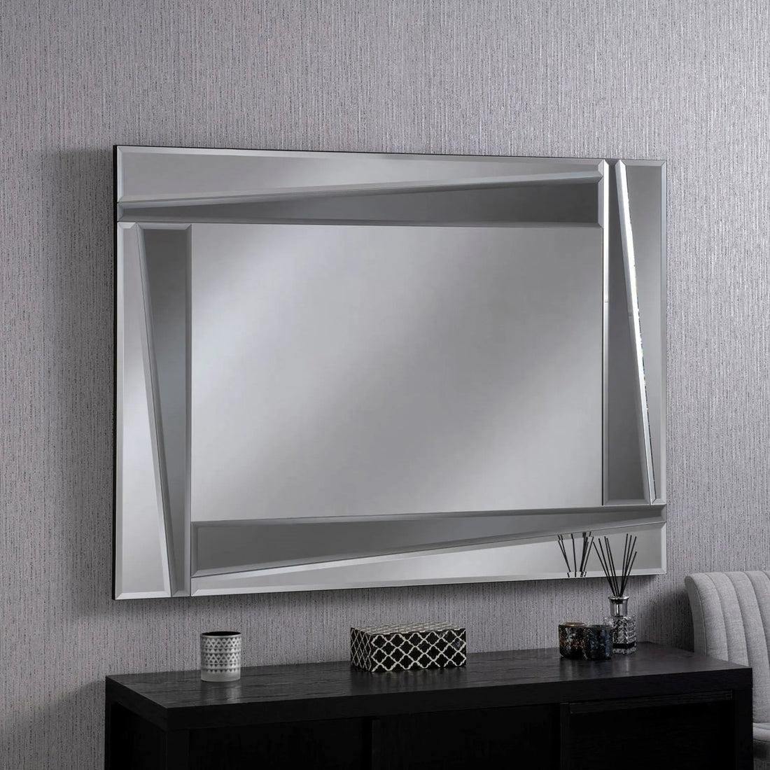 Two-Tone Wall Mirror has an ultra-modern style with powerful geometric lines created by mirror triangles with shades of grey and silver