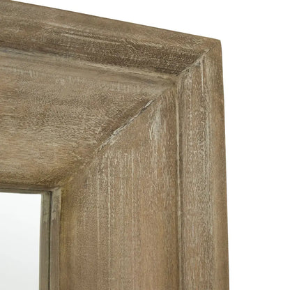 Close-up of a washed, bleached brown wooden framed mirror corner.