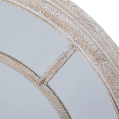 Circular, light-colored wooden framed mirror with arched window panes.